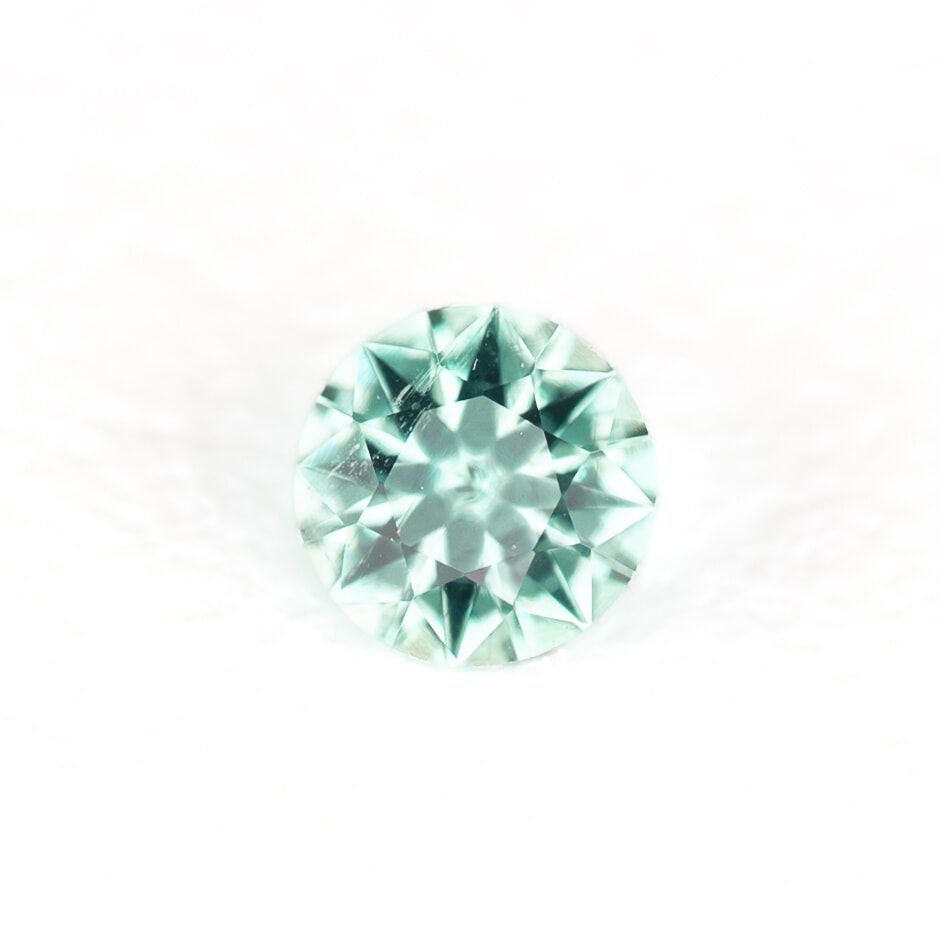 0.13 Carat Round Emerald